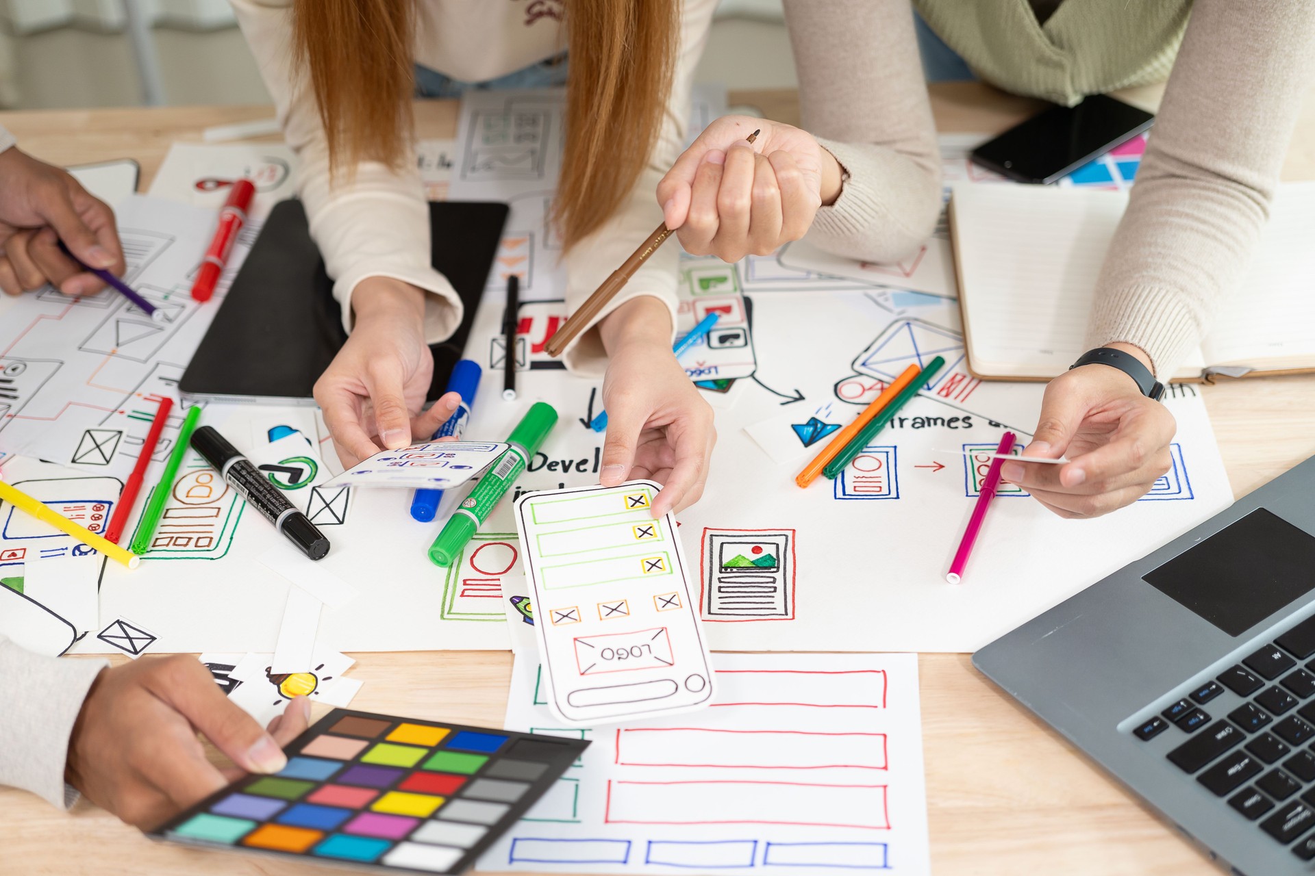 A team of UI/UX web designers is working together to develop a mobile responsive website with preview. 
Website development concepts UI UX